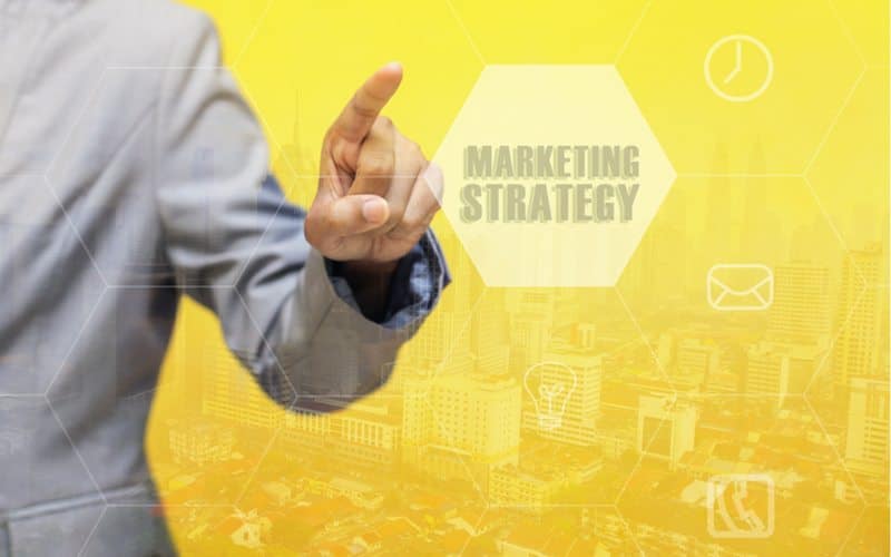 Guy clicking on Marketing Strategy Bubble
