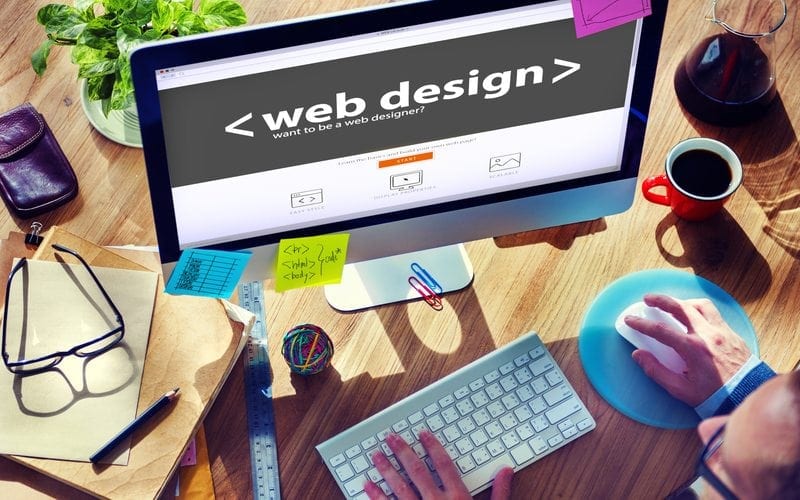 Person sitting at computer looking for a medical website design company
