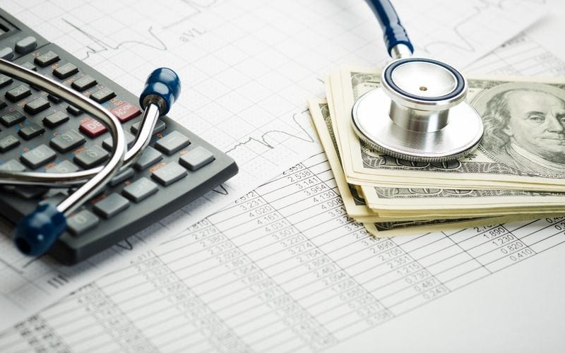 money and a stethoscope