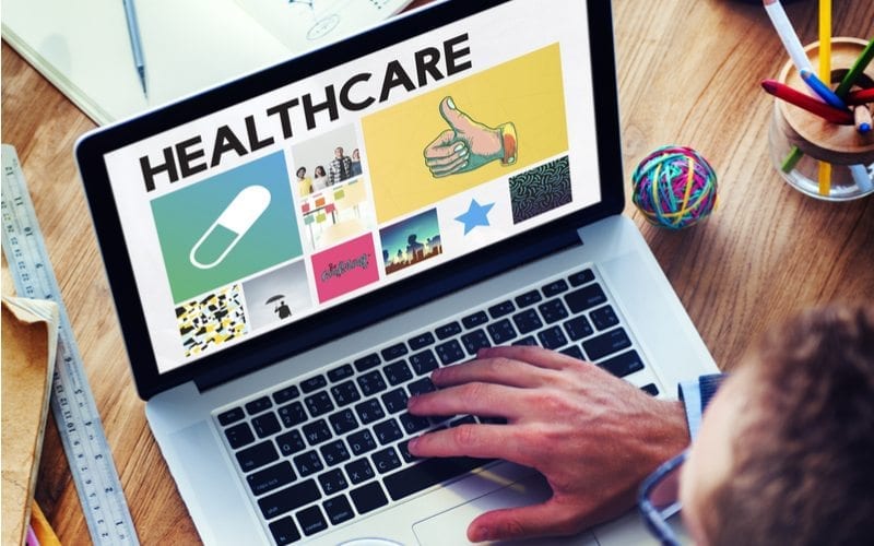 Graphic Designer contemplating a visual or informative approach to their medical website design