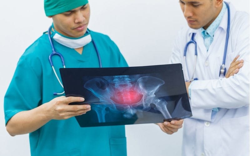 two orthopedic doctors reviewing an xray