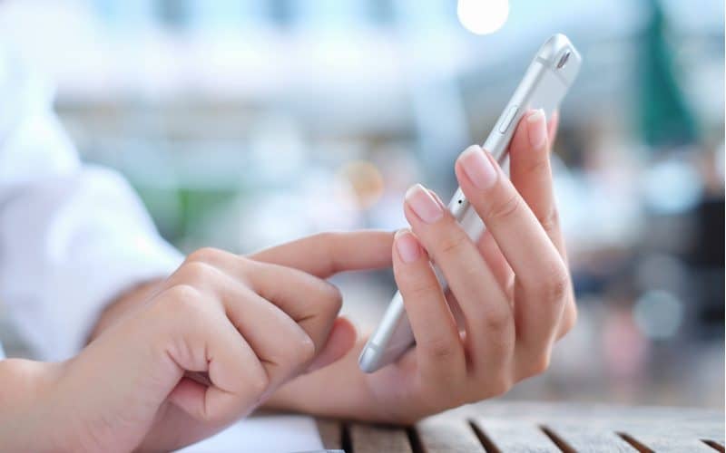 A Person Interacting with Mobile Marketing