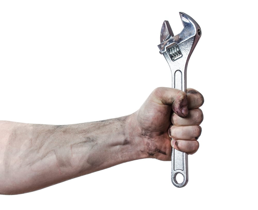 8 Key Factors To Great Customer Service 2 hand holding a wrench to reference fixing