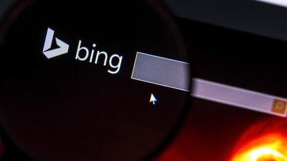 Close up of Bing.com's website under a magnifying glass .Bing is a search engine developed by Microsoft.